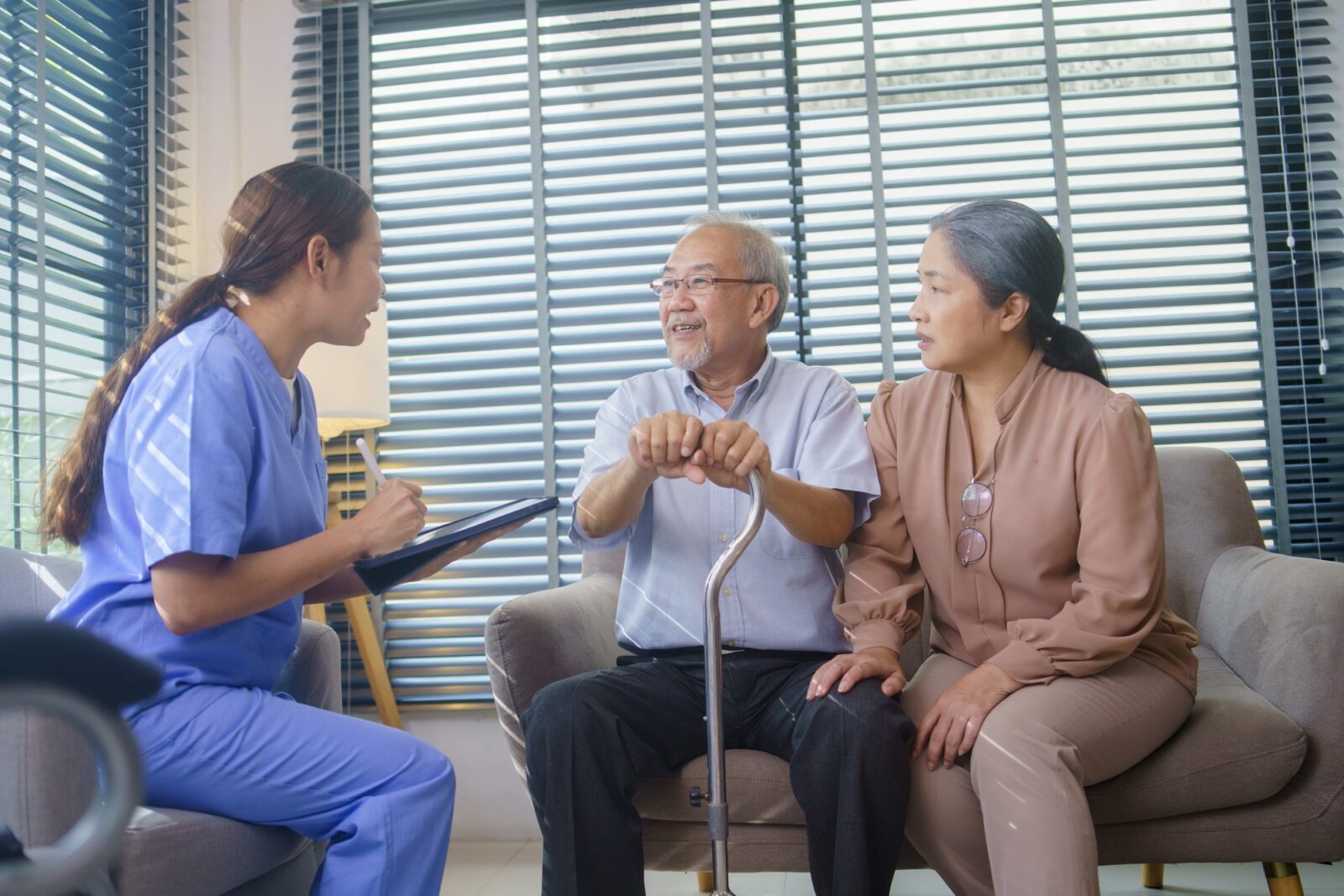 Asian nurse diagnosis and check up health of grandfather at home