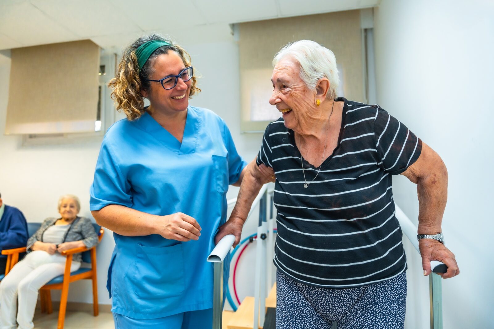 Senior patient doing physiotherapy with help of a therapist